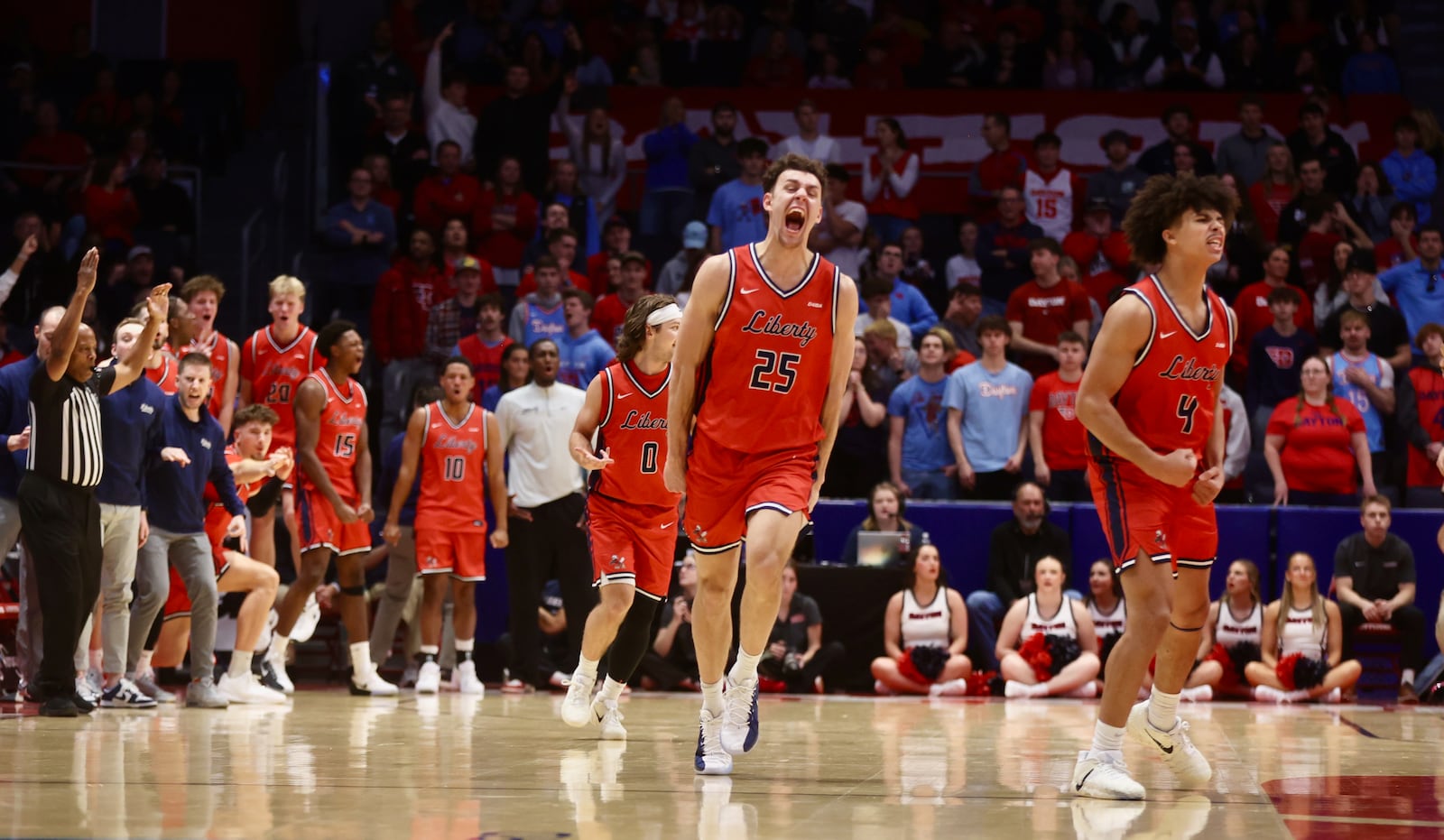 Liberty celebrates after a basket against Dayton on Saturday, Dec. 20, 2025, at UD Arena. David Jablonski/Staff