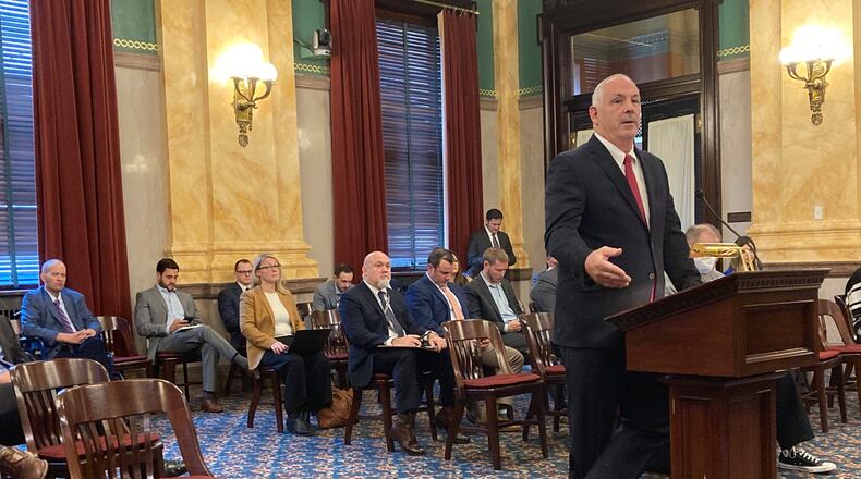 Sen. Steve Huffman, a Republican from Tipp City and a physician, answers questions about his bill that would expand Ohio's medical marijuana law, on Wednesday, Nov. 17, 2021, in Columbus, Ohio. Huffman, the sponsor of Ohio's current medical marijuana statute, has proposed increasing the square footage of marijuana cultivators' operations and the number of dispensaries able to sell the product. (AP Photo/Andrew Welsh-Huggins)