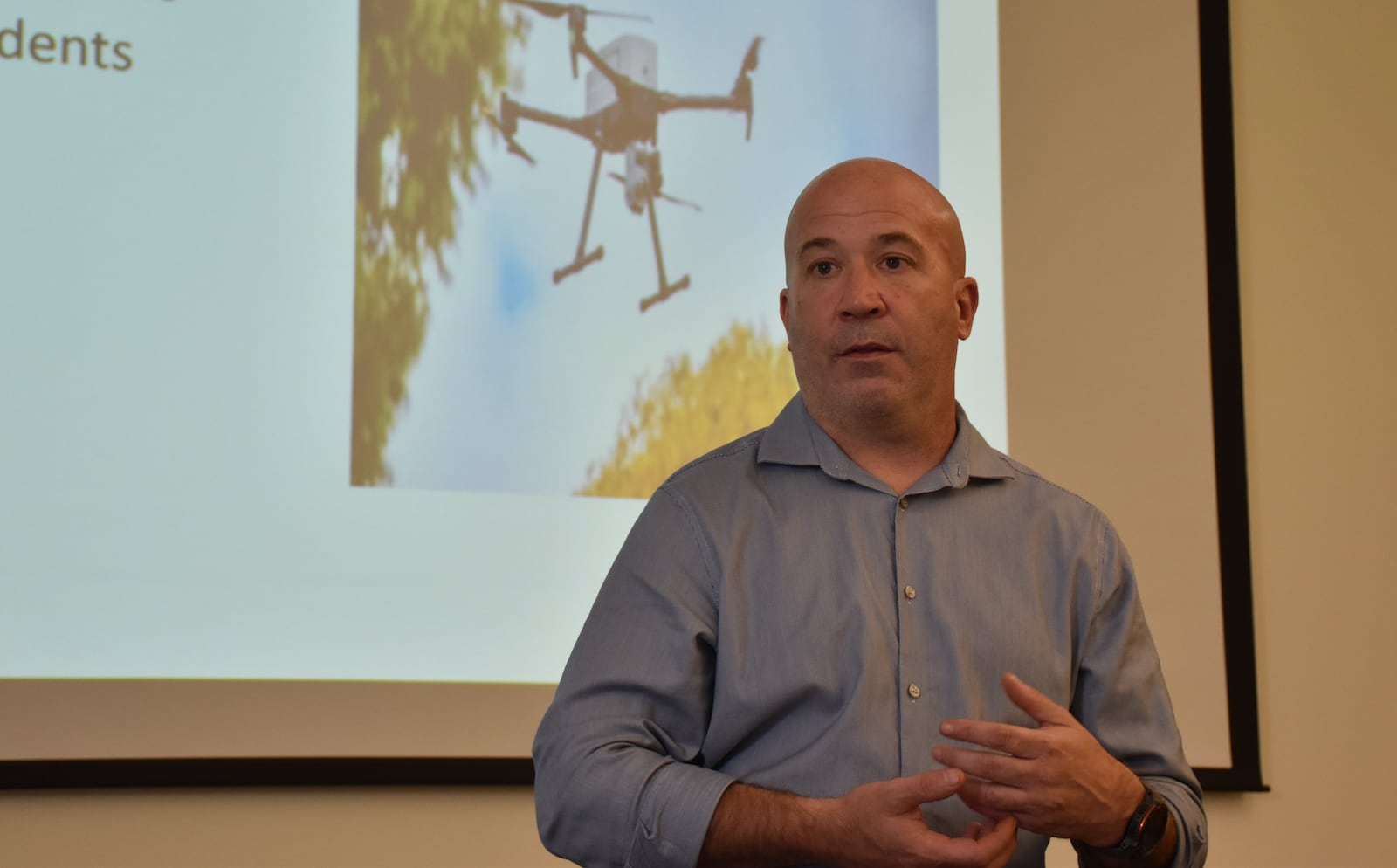 Dayton police Major Jason Hall discusses a proposed Drone as First Responder program at a community meeting on Sept. 4, 2025. CORNELIUS FROLIK / STAFF