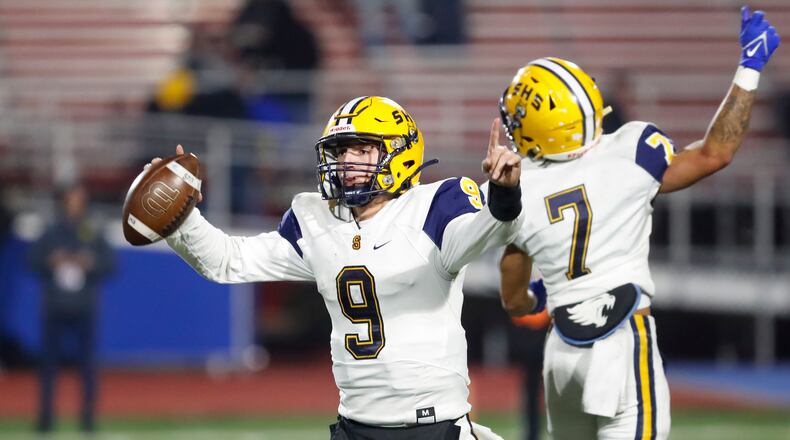 Springfield seniors Bryce Schondelmyer and Anthony Brown celebrate after the Wildcats beat Moeller 28-24 on Friday night at Piqua's Alexander Stadium to advance to the D-I state final for the second straight season. CONTRIBUTED PHOTO BY MICHAEL COOPER