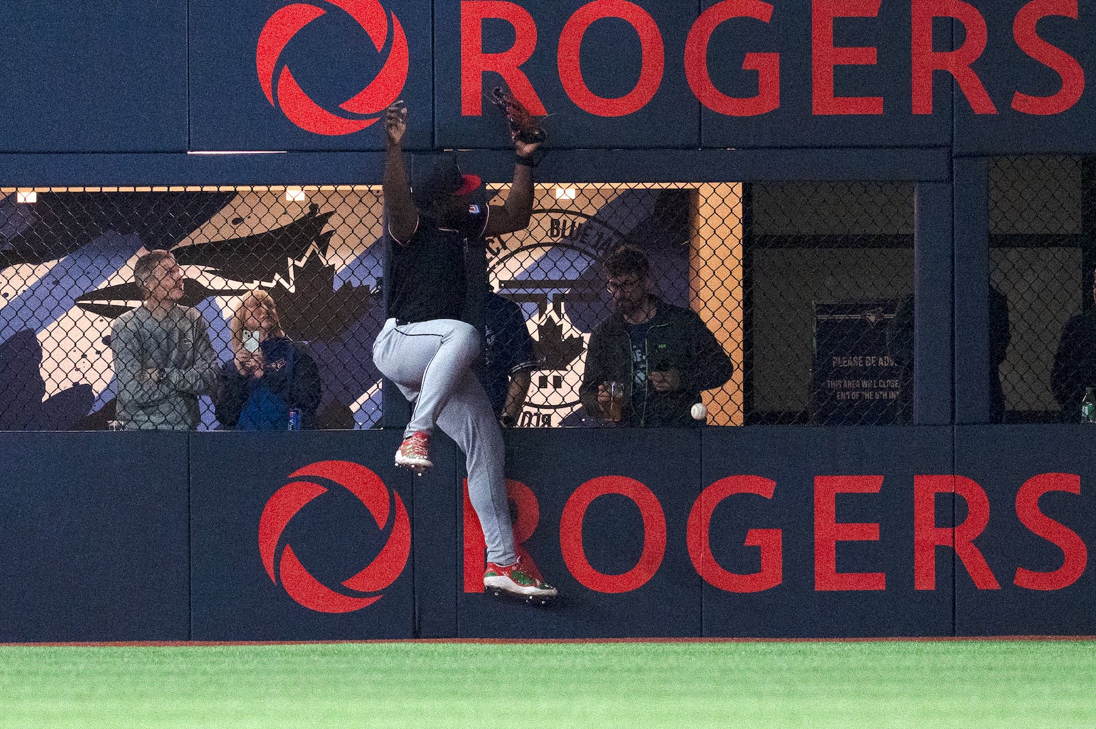 Cleveland Guardians right fielder Jhonkensy Noel (43) misplays a ball off the wall hit by Toronto Blue Jays right fielder George Springer for a double during the first inning of a baseball game in Toronto, Saturday, May 3, 2025. (Jon Blacker/The Canadian Press via AP)