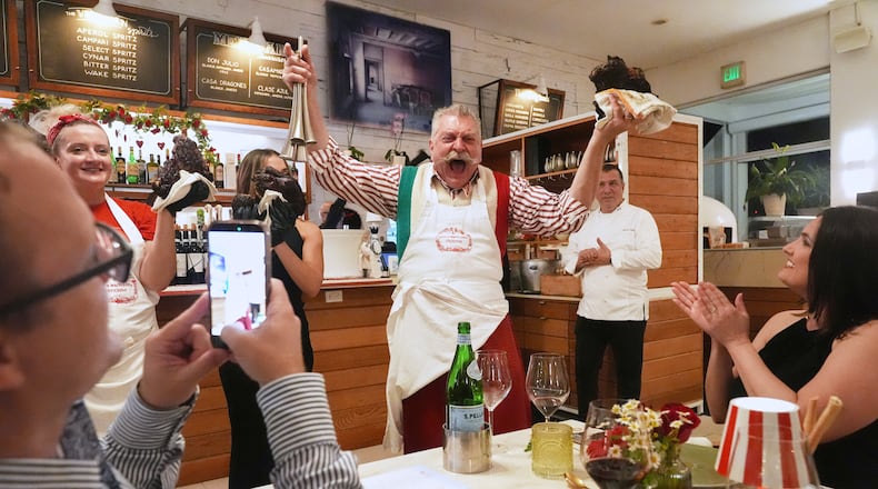 Butcher Dario Ceccini of Italy, welcomes guests to a private dinner at the South Beach Wine and Food Festival Saturday, Feb. 21, 2026, in Miami Beach, Fla. (AP Photo/Marta Lavandier)