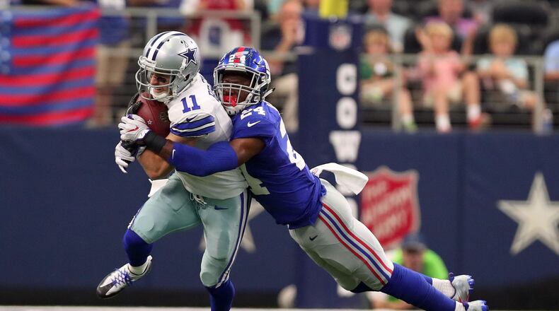 ARLINGTON, TX - SEPTEMBER 11: Cole Beasley #11 of the Dallas Cowboys is tackled by Eli Apple #24 of the New York Giants after catching a pass at AT&T Stadium on September 11, 2016 in Arlington, Texas. (Photo by Tom Pennington/Getty Images)