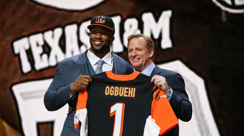 CHICAGO, IL - APRIL 30: Cedric Ogbuehi of the Texas A&M Aggies holds up a jersey with NFL Commissioner Roger Goodell after being picked #21 overall by the Cincinnati Bengals during the first round of the 2015 NFL Draft at the Auditorium Theatre of Roosevelt University on April 30, 2015 in Chicago, Illinois. (Photo by Jonathan Daniel/Getty Images)