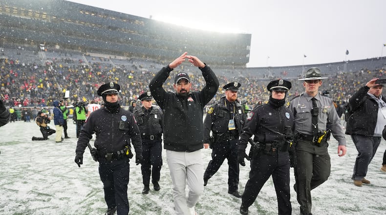 Ohio State Buckeyes head coach Ryan Day celebrates after the team's win against Michigan in an NCAA college football game, Saturday, Nov. 29, 2025, in Ann Arbor, Mich. (AP Photo/Ryan Sun)