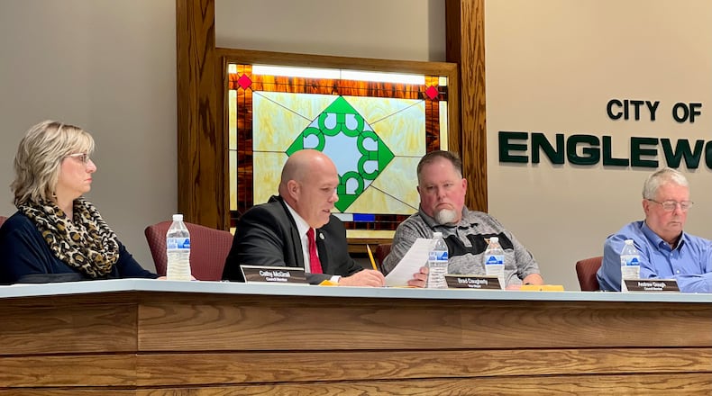 During the Oct. 24 council meeting, Englewood Vice Mayor Brad Daugherty, second from left, reads a statement submitted by a woman Daugherty said made allegations against former council member Darren Sawmiller. AIMEE HANCOCK/STAFF