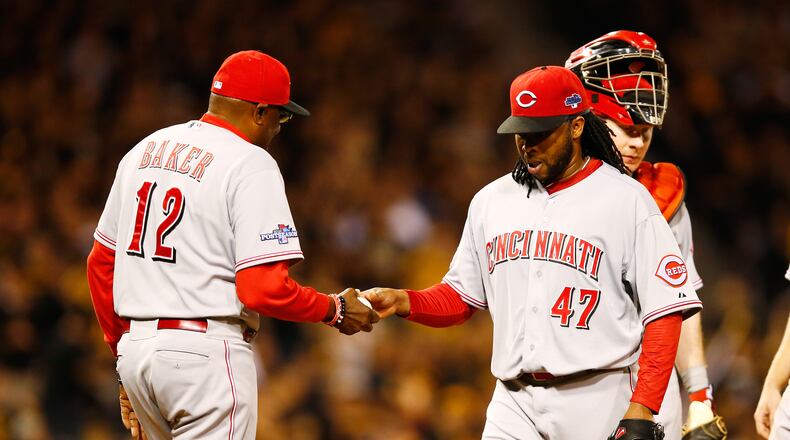 PITTSBURGH, PA - OCTOBER 01: Manager Dusty Baker #12 pulls Johnny Cueto #47 of the Cincinnati Reds in the fourth inning against the Pittsburgh Pirates during the National League Wild Card game at PNC Park on October 1, 2013 in Pittsburgh, Pennsylvania. (Photo by Justin K. Aller/Getty Images)