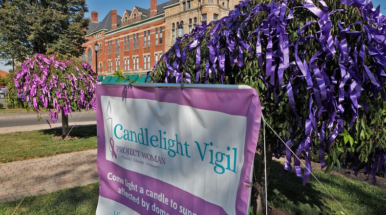 Project Woman holds a candlelight vigil annually in October to show their support for the victims of domestic violence and raise awareness of the issue. BILL LACKEY/STAFF Bill Lackey/Staff