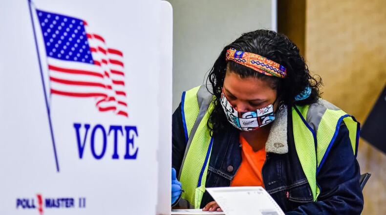 Voting in Ohio began in early October with in-person options like this at the Montgomery County Board of Elections and by absentee ballot using the mail.