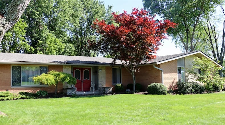 This brick ranch with about 2,240 sq. ft. of living space sits diagonally on a corner lot. Inside, the house has formal areas and comfortable causal areas. CONTRIBUTED PHOTOS BY KATHY TYLER