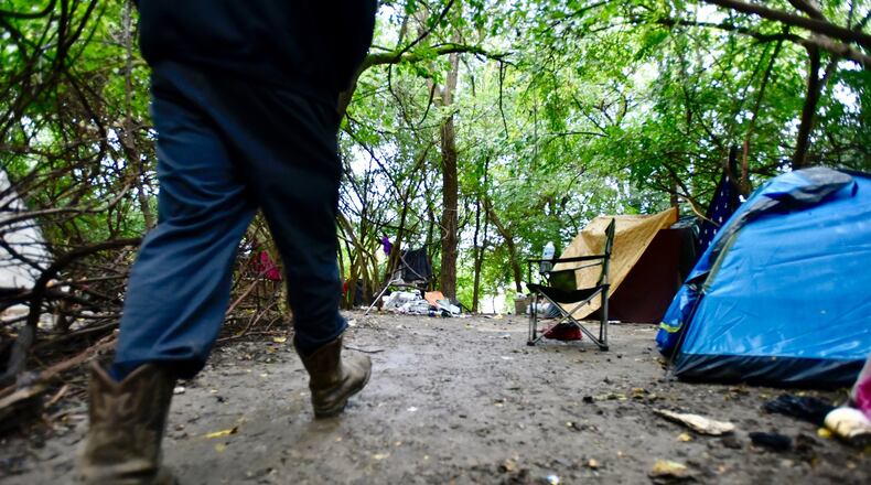 The residents of a tent city behind Hamilton Plaza on Ohio 4 were given a Sept. 30 deadline to vacate the area. NICK GRAHAM/STAFF