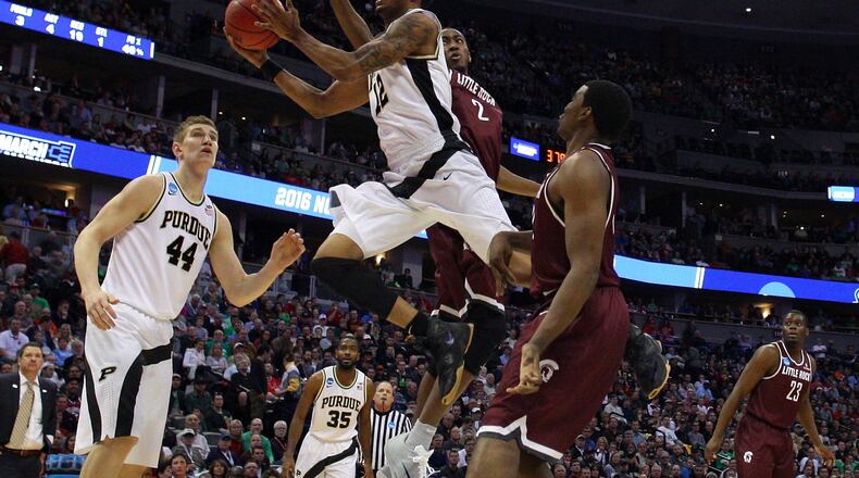 DENVER, CO - MARCH 17: Vince Edwards #12 of the Purdue Boilermakers shoots the ball ober Daniel Green #2 of the Arkansas Little Rock Trojans during the first round of the 2016 NCAA Men’s Basketball Tournament at the Pepsi Center on March 17, 2016 in Denver, Colorado. (Photo by Justin Edmonds/Getty Images)