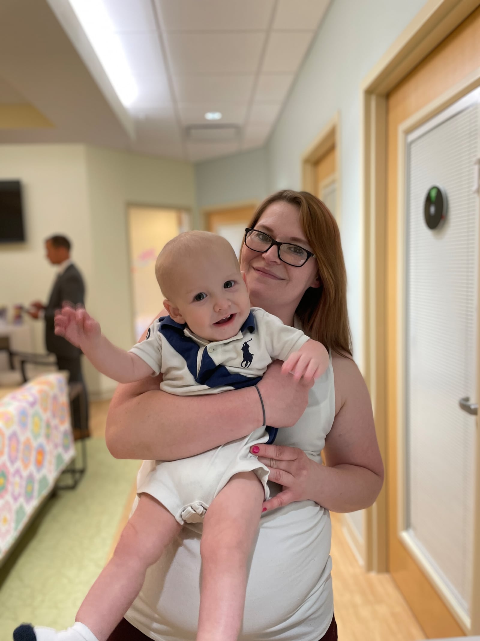 Ashley Wells, of Cincinnati, with her son Asher at Brigid's Path in Kettering, which helped with her son's recovery from his neonatal abstinence syndrome. SAM WILDOW/STAFF