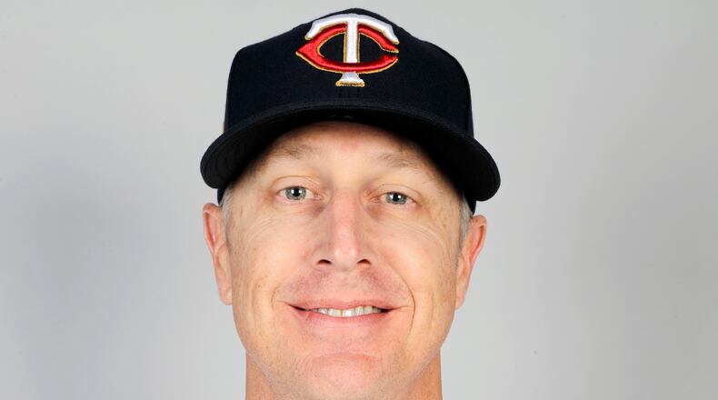 FILE - This is a 2020 file photo showing Mike Bell of the Minnesota Twins baseball team. Twins bench coach Mike Bell has taken an indefinite leave from the team because of kidney cancer. The 46-year-old Bell had surgery to remove the growth on Jan. 28, shortly after being diagnosed. He's been recovering at home with his family in Arizona. “He’s also very, very optimistic and also very encouraged and waiting for his return to the dugout," manager Rocco Baldelli said Wednesday, Feb. 17, 2021. (AP Photo/Brynn Anderson, File)