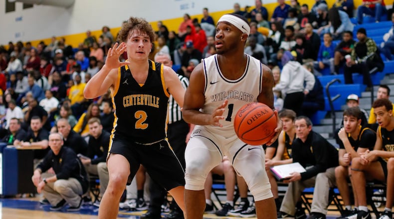 Springfieldâs Larry Stephens dribbles past Centervilleâs Drew Thompson during their game on Saturday night. The Elks won 52-36. CONTRIBUTED PHOTO BY MICHAEL COOPER