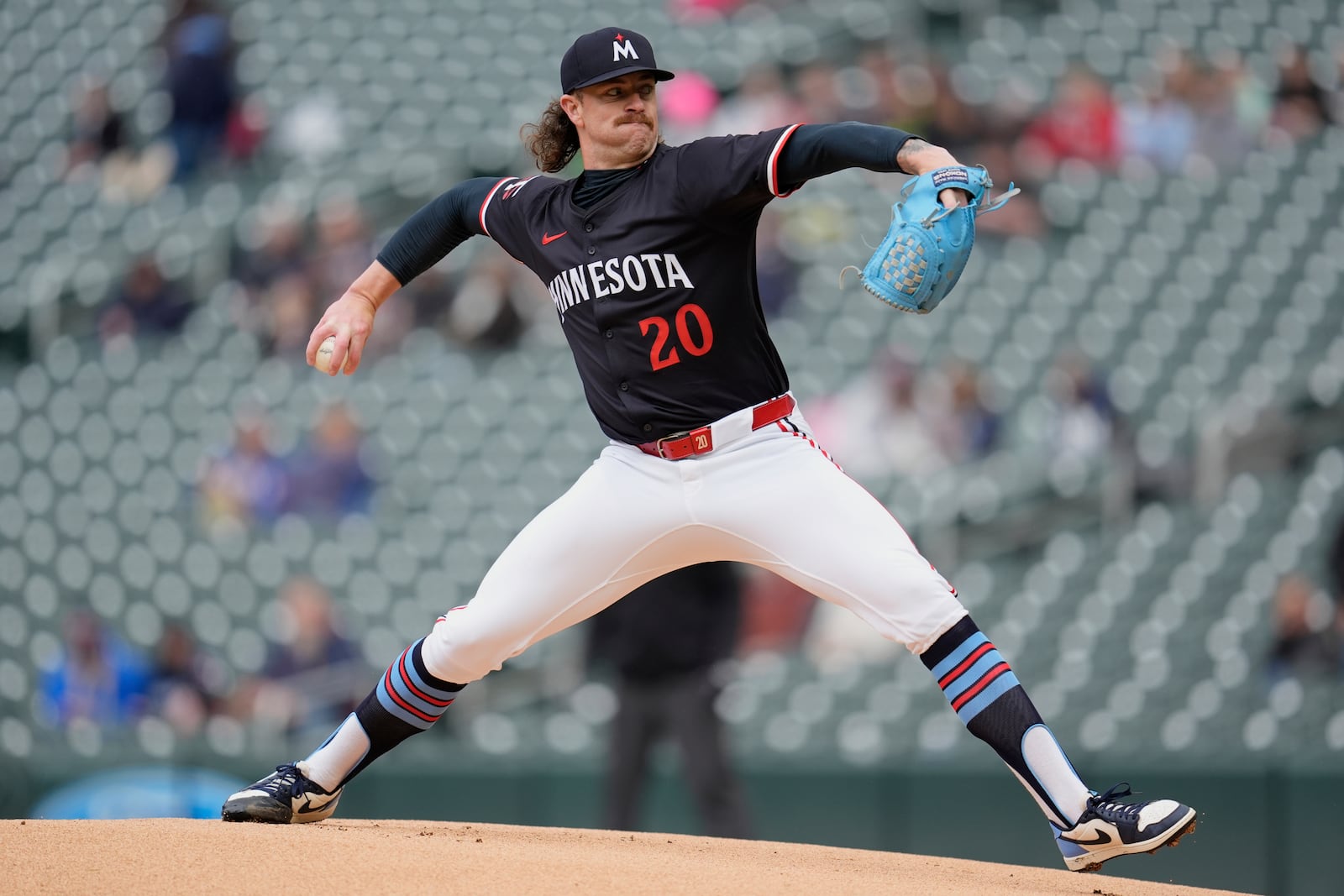 Minnesota Twins starting pitcher Chris Paddack (20) delivers during the first inning in the second baseball game of a doubleheader against the Cleveland Guardians, Wednesday, May 21, 2025, in Minneapolis. (AP Photo/Abbie Parr)
