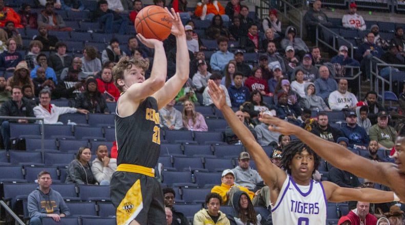 Centerville's Kyle Kenney goes up for one of the two 3-pointers he made in the first half of the Elks' double-overtime victory Saturday night at Nationwide Arena. CONTRIBUTED/Jeff Gilbert