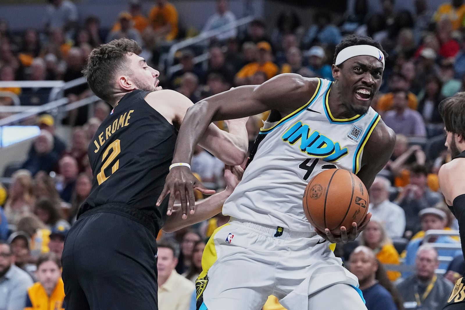 Indiana Pacers forward Pascal Siakam (43) drives to the basket against Cleveland Cavaliers guard Ty Jerome (2) in the second half of Game 4 in the Eastern Conference semifinals of the NBA basketball playoffs in Indianapolis, Sunday, May 11, 2025. (AP Photo/Michael Conroy)