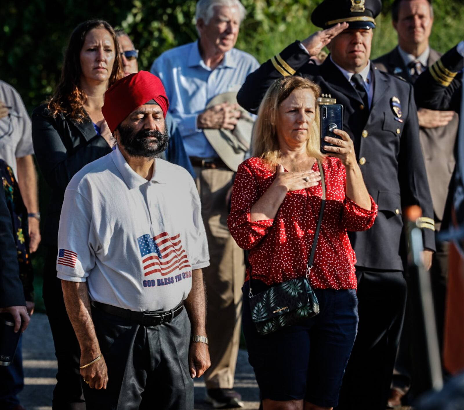 Nearly 100 people gathered at the Beavercreek 911 Memorial Monday September 11, 2023 for a remembrance ceremony honoring the thousands who died 22 years ago. JIM NOELKER/STAFF