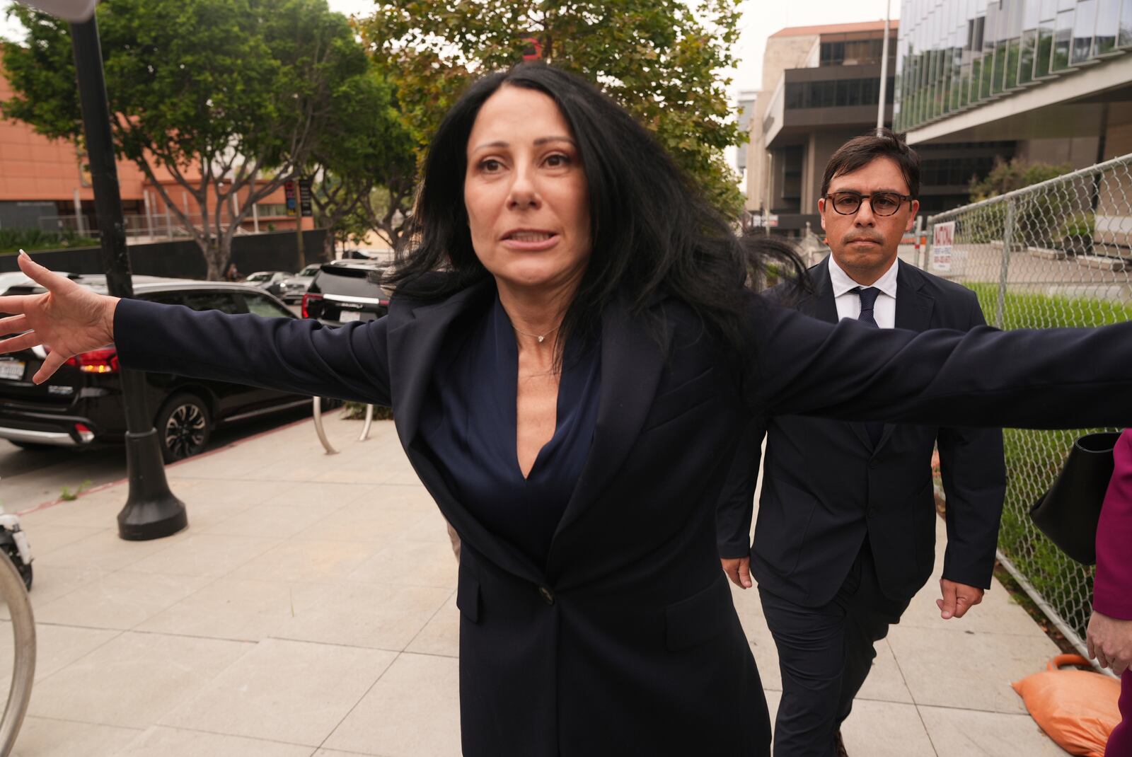 Dr. Salvador Plasencia, right, walks behind his Attorney Debra S. White as he leaves federal court on Wednesday, July 23, 2025 in Los Angeles, after pleading guilty to giving ketamine to Matthew Perry, leading up to the actor's 2023 overdose death. (AP Photo/Damian Dovarganes)