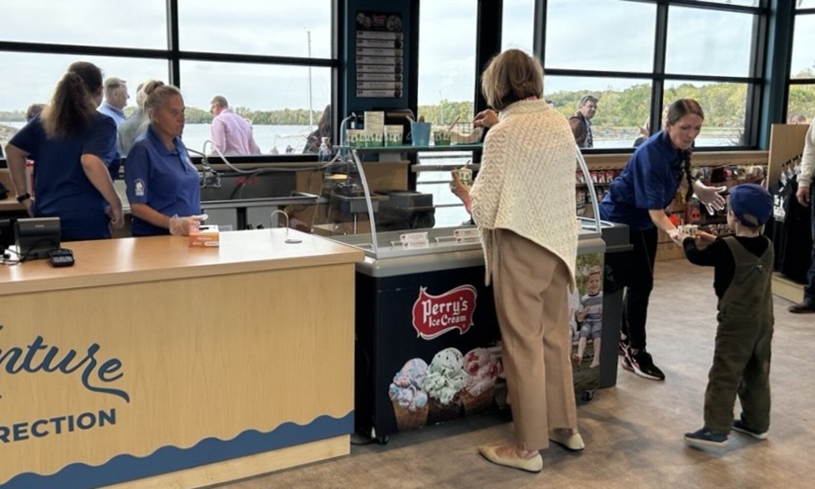 Ohio First Lady Fran DeWine and her grandson get ice cream from the newly finished marina at Buck Creek State Park in Springfield Friday, Oct. 17, 2025. JESSICA OROZCO/STAFF