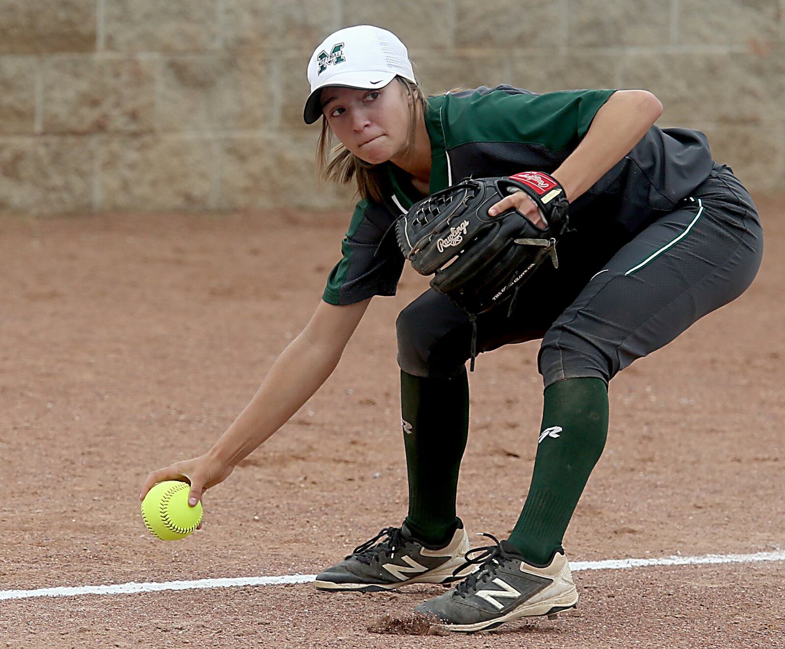 Mason third baseman Tori O’Brien fields a Lebanon bunt during Sunday’s Division I regional final at Kings. CONTRIBUTED PHOTO BY E.L. HUBBARD