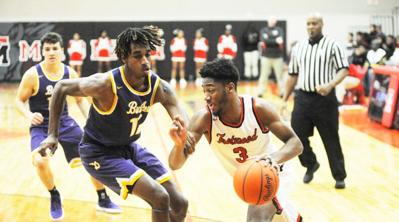 Sammy Anderson of Trotwood-Madison (with ball) drives. MARC PENDLETON / STAFF