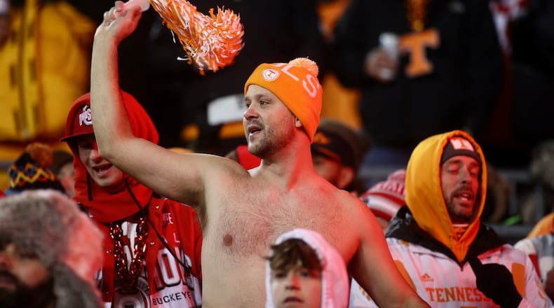 A Tennessee fan braves the cold befgore a game against Ohio State in the first round of the College Football Playoff on Saturday, Dec. 21, 2024, at Ohio Stadium in Columbus. David Jablonski/Staff