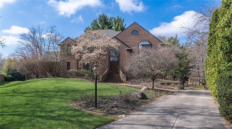 The brick West Kettering home has three finished levels and includes six bedrooms.