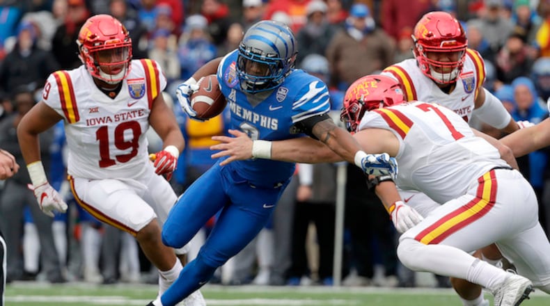 In this Dec. 30, 2017, file photo, Memphis wide receiver Anthony Miller (3) pushes past Iowa State linebacker Joel Lanning (7) to score a touchdown in the Liberty Bowl NCAA college football game in Memphis, Tenn. Miller is trying really hard to follow the advice given to him at the NFL combine. Just slow down, just enough to stay focused and avoid making a mistake simply because the wide receiver is moving too fast. That's easier said than done for the man who had no offers from any FBS college school coming out of high school who chose to walk on at Memphis. Miller is in a hurry to prove he's the best wide receiver available in the 2018 NFL draft. (AP Photo/Mark Humphrey, File)