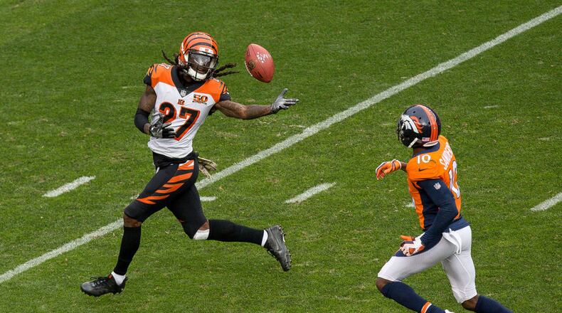 DENVER, CO - NOVEMBER 19: Cornerback Dre Kirkpatrick #27 of the Cincinnati Bengals fumbles the ball after an 87 yard return and is chased down by wide receiver Emmanuel Sanders #10 of the Denver Broncos after intercepting a pass in the first quarter of a game at Sports Authority Field at Mile High on November 19, 2017 in Denver, Colorado. Kirkpatrick recovered the fumble. (Photo by Justin Edmonds/Getty Images)