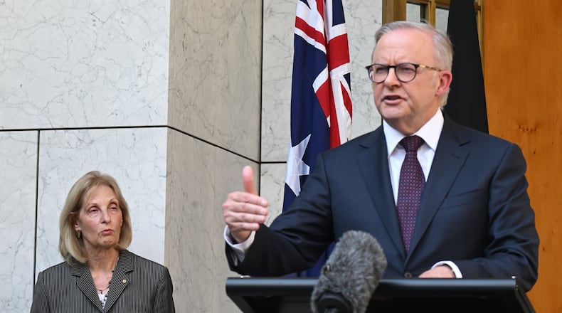 Jillian Siegel, Special Envoy to Combat Antisemitism in Australia listens to Prime Minister Anthony Albanese speak to the media during a press conference at Parliament House in Canberra, Australia, Thursday, Jan. 8, 2026. (Lukas Coch/AAP Image via AP)