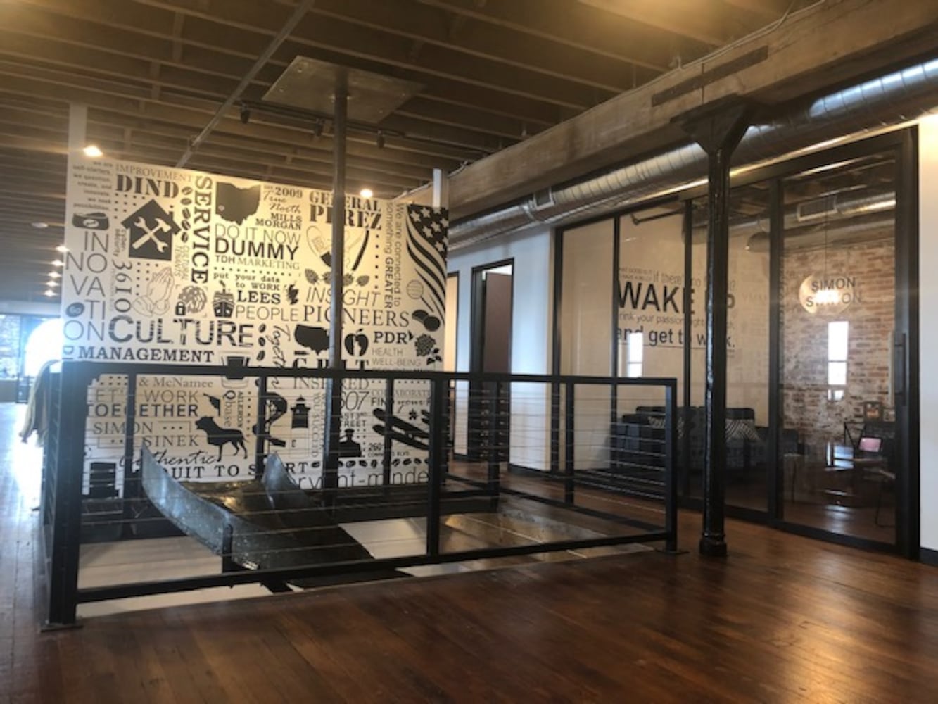 PHOTOS: Inside the new downtown Dayton office that has an industrial slide