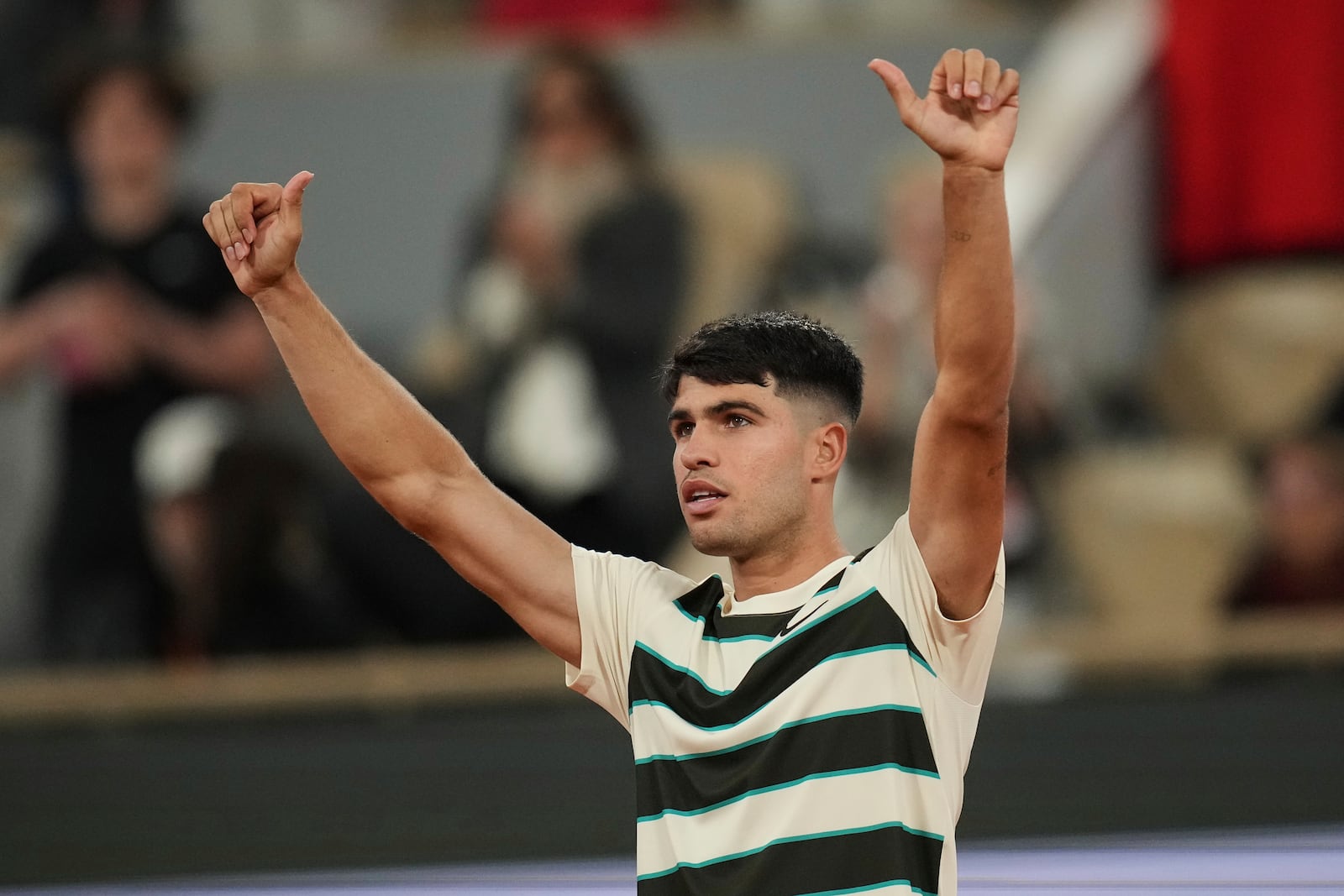 Spain's Carlos Alcaraz celebrates beating Hungary's Fabian Maroszan after their second round match of the French Tennis Open, at the Roland-Garros stadium, in Paris, Wednesday, May 28, 2025. (AP Photo/Christophe Ena)