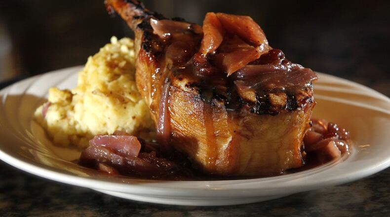 The Amber Rose Restaurant and Catering is a Dayton institution specializing in homemade Eastern European cuisine. On the restaurant’s regular menu is a bone-in smoked porkchop topped with cinnamon apple demi-glaze and served with mashed potatoes. The restaurant will be offering special dishes during Restaurant Week in addition to the regular menu items. LISA POWELL / STAFF