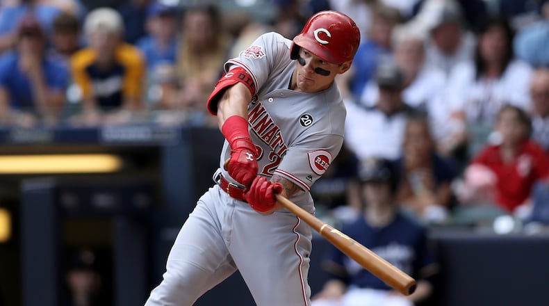 MILWAUKEE, WISCONSIN - JUNE 22:  Derek Dietrich #22 of the Cincinnati Reds hits a triple in the first inning against the Milwaukee Brewers at Miller Park on June 22, 2019 in Milwaukee, Wisconsin. (Photo by Dylan Buell/Getty Images)