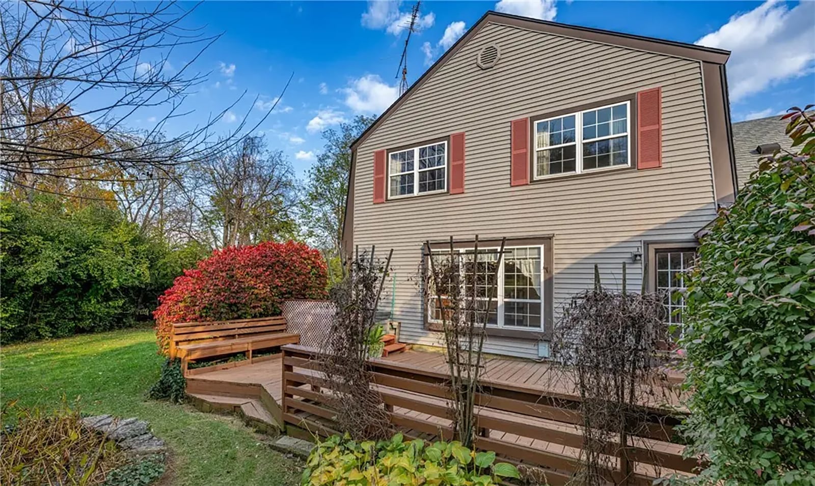 The home sits on slightly more than a half acre and has many mature trees, a wood deck with built in benches in the back with a hot tub and a side patio. CONTRIBUTED