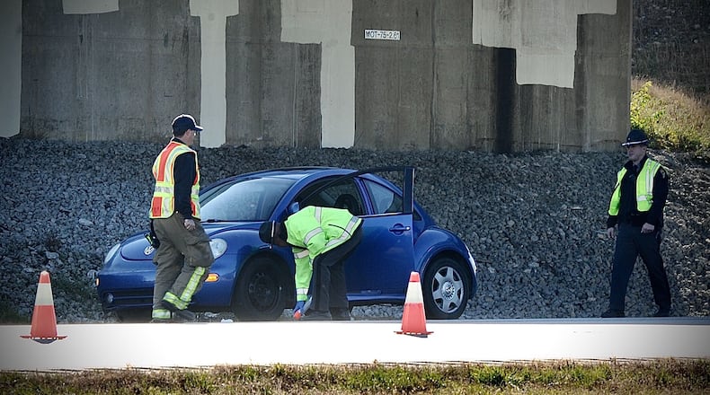 Miami Twp. police and Ohio State Highway Patrol troopers work at a crash scene Nov. 8, 2021, on northbound Interstate 75 in Miami Twp. Township trustees are working to determine the size and millage amount for a police levy to replace one that is about to expire. MARSHALL GORBY/STAFF