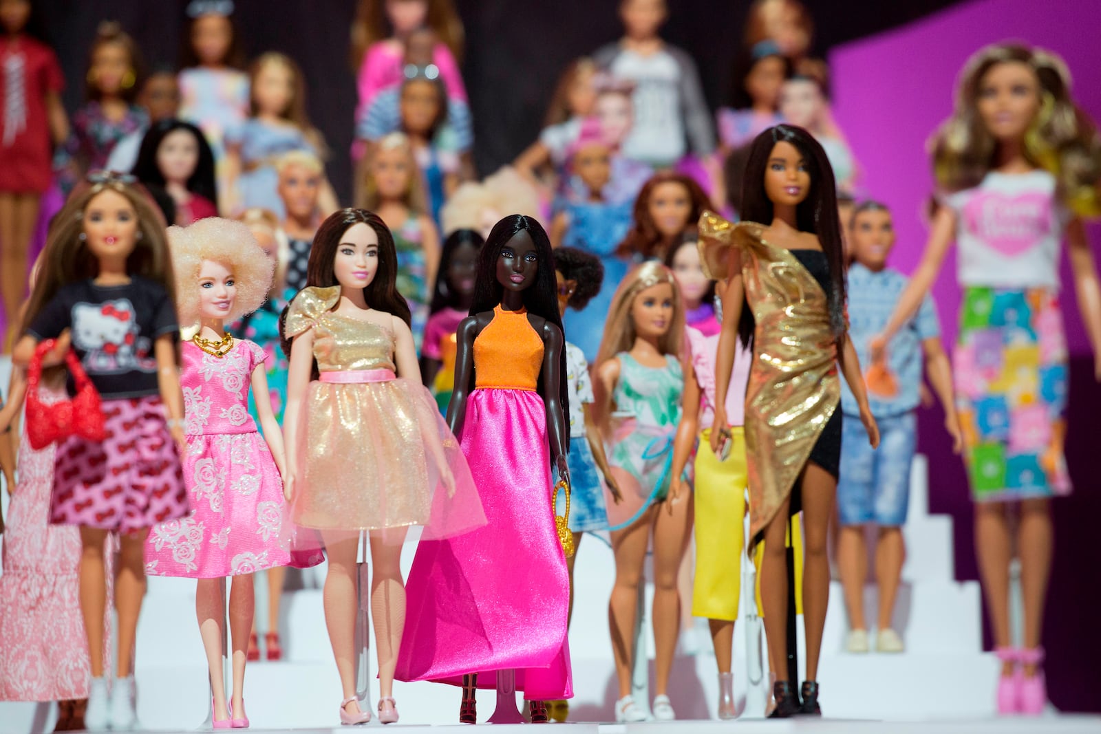 FILE- In this Feb. 20, 2018, file photo dozens of Barbie dolls are displayed at the Mattel showroom at Toy Fair in New York. Mattel reports earnings Thursday, April 26. (AP Photo/Mark Lennihan, File)