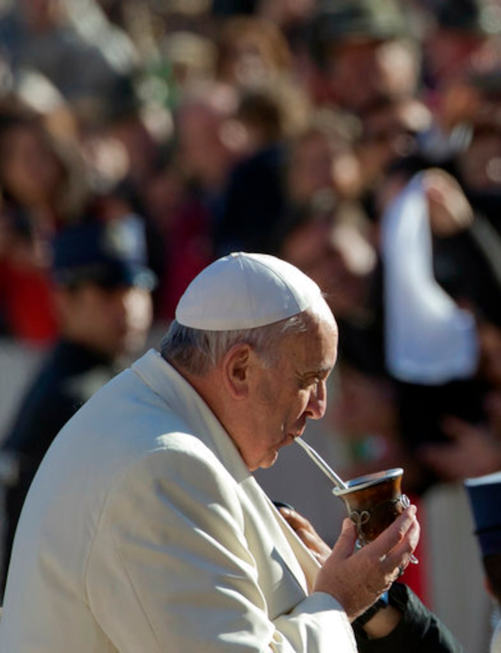 FILE - Pope Francis drinks from a mate gourd, a traditional South American cup, upon his arrival for his weekly general audience in St. Peter's Square at the Vatican, Wednesday, Dec. 17, 2014. (AP Photo/Alessandra Tarantino, file)