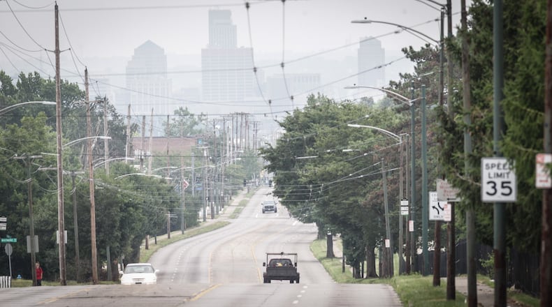 Summer haze surrounds Dayton from the top of Third St. hill. JIM NOELKER/STAFF