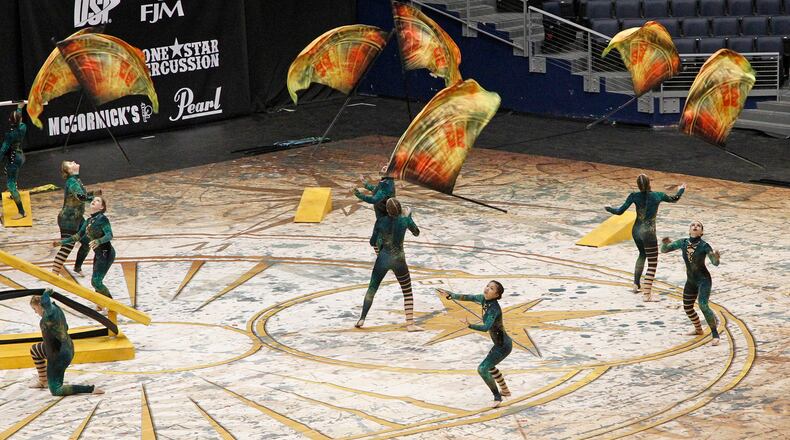 Miamisburg High School World Guard performs at the Winter Guard International competition at UD Arena on Thursday morning.  More than 12,000 participants from 350 winter guards and 250 percussion lines are competing at regional venues over the next two weeks  including the Nutter Center, Hobart Arena, Cintas Center at Xavier University and BB&T Arena at Northern Kentucky University.  This is the 33rd year the competition has been in Dayton.     TY GREENLEES / STAFF