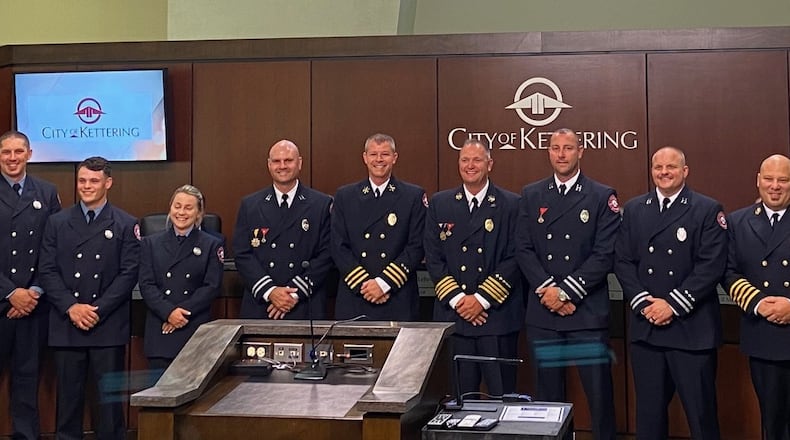 Kettering recently promoted or swore in more than a dozen firefighters. From left to right are firefighter/paramedic Josh Mumpower, firefighter/paramedic Justin Poppe, firefighter/paramedic Dakota Mangan, firefighter/paramedic Danielle Walter, Capt. Ryan McClure, Battalion Chief Brett Davenport, Assistant Chief Brian Beaver, Capt. AJ Bacon, Capt. Kent Denlinger, Chief Mitch Robbins, and Assistant Chief Michael Miller. Not pictured are firefighter/paramedics Brandon Boykin, Scott Burrows, Matthew Ray and Jonathan Steinker. CONTRIBUTED