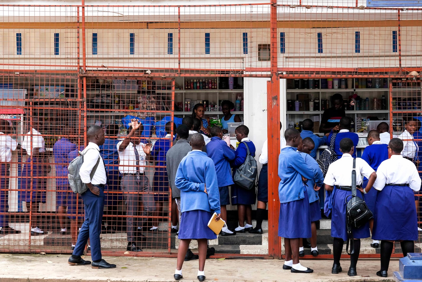 Students shop at the school canteen during lunch break at Uganda Martyrs' Secondary School Namugongo, in Kampala, Uganda Monday, May 26, 2025. (AP Photo/Hajarah Nalwadda)