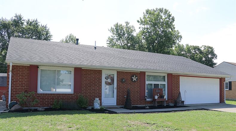 The 3-bedroom ranch has about 1,380 sq. ft. of living space. The exterior is nearly maintenance free as the brick home has had a new roof installed in 2016 and has vinyl windows. There is a 2-car garage with side service door and pull-down attic access. CONTRIBUTED PHOTO BY KATHY TYLER
