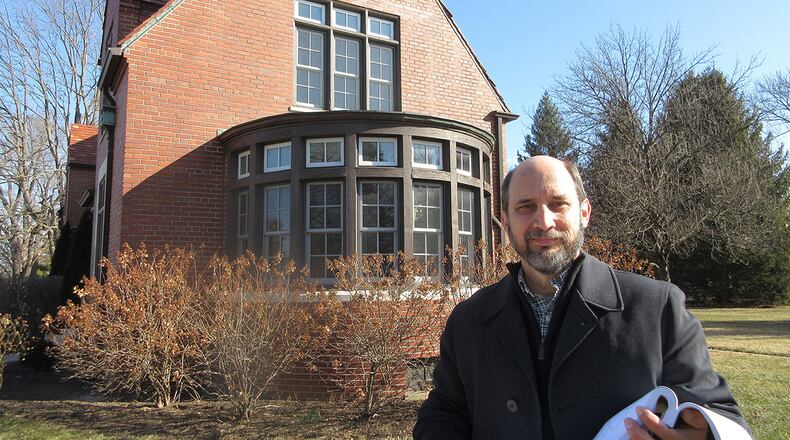 Steve Byington, the 88th Civil Engineer Group’s cultural resources manager, reviews architectural plans at the Brick Quarters on Wright-Patterson Air Force Base. CONTRIBUTED PHOTO