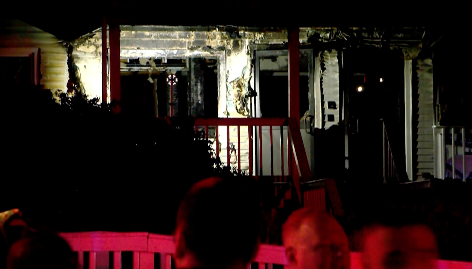 This image taken from video provided by WLNE-TV shows authorities working on the scene of a fire at an assisted living facility in Fall River, Mass., Sunday, July 13, 2025. (WLNE-TV via AP)