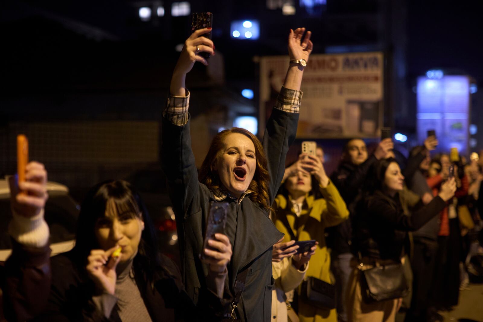 A person shouts as a group of students who walked across the country arrive at an anti-corruption protest in the southwestern town of Novi Pazar, Serbia, Friday, April 11, 2025. (AP Photo/Marko Drobnjakovic)