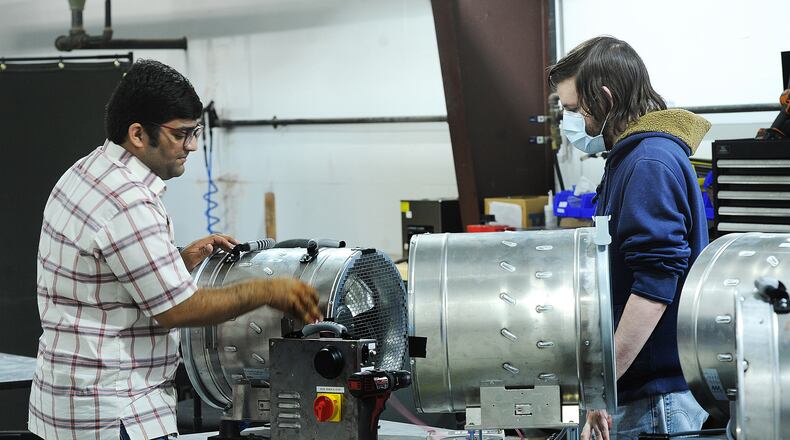 Aeroseal employees Charles Kumar, left, and Eric Levine, run tests on new products. MARSHALL GORBY\STAFF