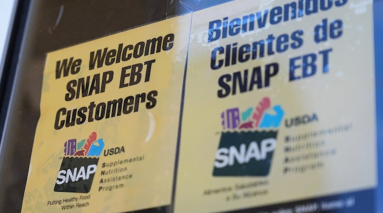 FILE - A SNAP EBT information sign is displayed outside of a convenience store in Baltimore, Monday, Nov. 10, 2025. (AP Photo/Stephanie Scarbrough)